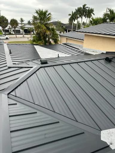 Roof after replacement with a clean, finished metal surface.